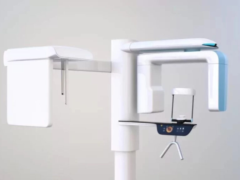 Modern cone beam computed tomography (CBCT) machine used for detailed 3D imaging of a patient's dental structures, consisting of a central column with an arm that holds the X-ray source and detector, rotating around the patient's head.